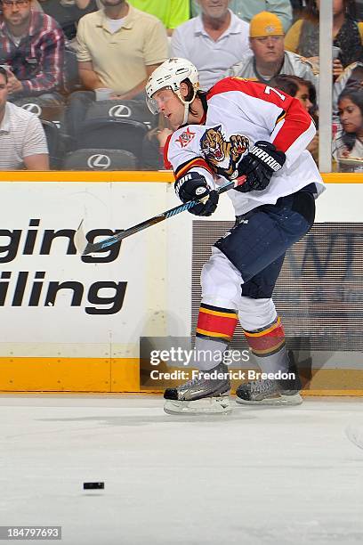 Tom Gilbert of the Florida Panthers plays against the Nashville Predators at Bridgestone Arena on October 15, 2013 in Nashville, Tennessee.