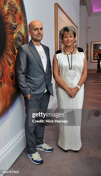 Marc Quinn and Myriam Ullens attend Mimi Foundation "The Power of Love" gala dinner and auction at Sotheby's on October 16, 2013 in London, England.