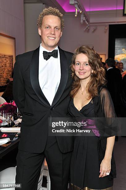 Alex Branczik and Isabelle Paagman attend Mimi Foundation "The Power of Love" gala dinner and auction at Sotheby's on October 16, 2013 in London,...
