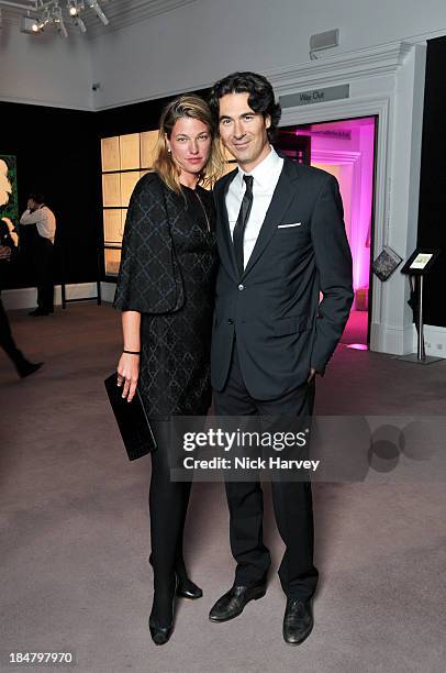 Nicole Junkermann and Alexis Bonte attend Mimi Foundation "The Power of Love" gala dinner and auction at Sotheby's on October 16, 2013 in London,...