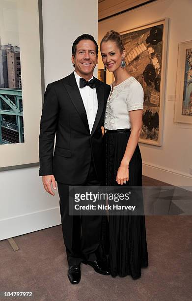 Matt Dalton and Kerry Dalton attend Mimi Foundation "The Power of Love" gala dinner and auction at Sotheby's on October 16, 2013 in London, England.