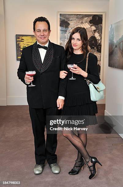 Detmar Blow and Rebecca Thomas attend Mimi Foundation "The Power of Love" gala dinner and auction at Sotheby's on October 16, 2013 in London, England.