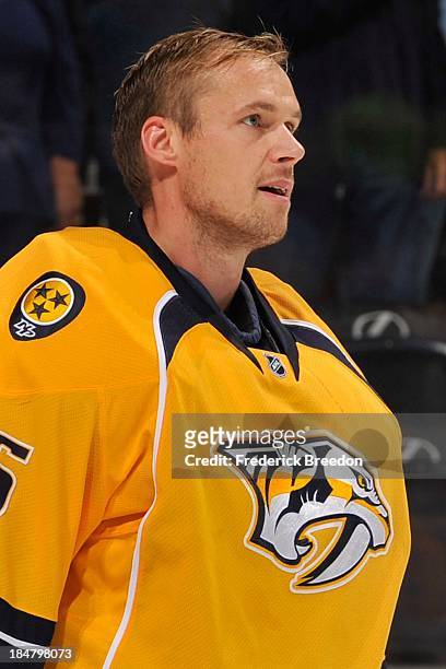 Goalie Pekka Rinne of the Nashville Predators stands during the National Anthem prior to a game against the Florida Panthers at Bridgestone Arena on...