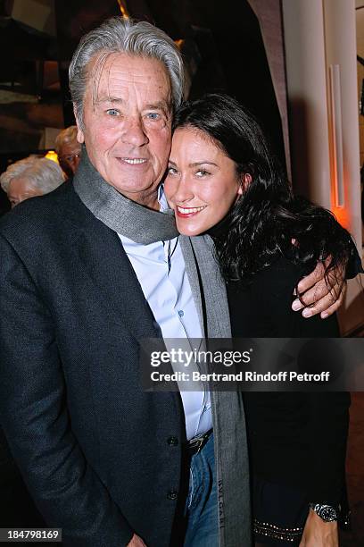 Actor Alain Delon and Anne Moureau attend the Jean-Paul Moureau book signing for 'Soigner Autrement' at Hotel Park Hyatt Paris Vendome on October 16,...