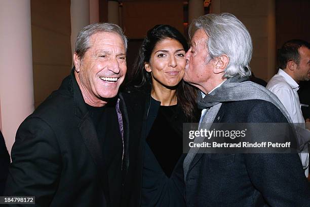 Jean-Claude Darmon with his companion Hoda Roche and Actor Alain Delon attend the Jean-Paul Moureau book signing for 'Soigner Autrement' at Hotel...