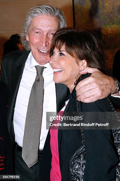 Jean-Paul Moureau and singer Liane Foly attend the Jean-Paul Moureau book signing for 'Soigner Autrement' at Hotel Park Hyatt Paris Vendome on...