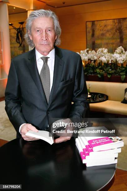 Jean-Paul Moureau signs his book 'Soigner Autrement' at Hotel Park Hyatt Paris Vendome on October 16, 2013 in Paris, France.