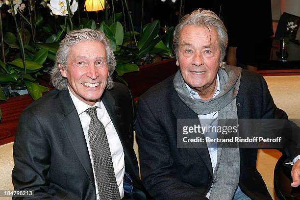 Actor Alain Delon and Jean-Paul Moureau attend the Jean-Paul Moureau book signing for 'Soigner Autrement' at Hotel Park Hyatt Paris Vendome on...