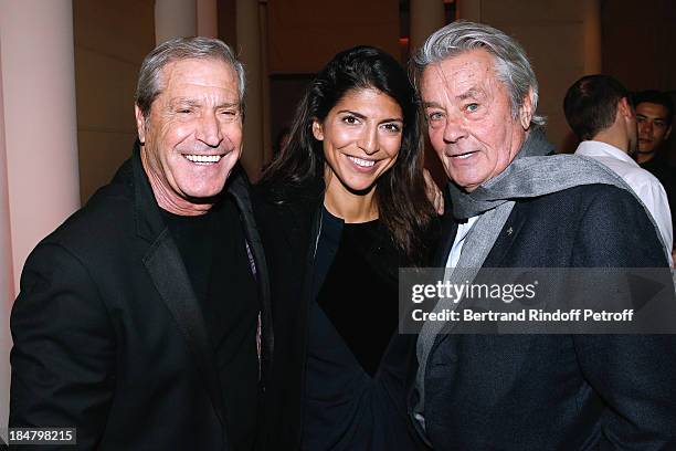 Jean-Claude Darmon with his companion Hoda Roche and Actor Alain Delon attend the Jean-Paul Moureau book signing for 'Soigner Autrement' at Hotel...