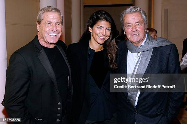 Jean-Claude Darmon with his companion Hoda Roche and Actor Alain Delon attend the Jean-Paul Moureau book signing for 'Soigner Autrement' at Hotel...