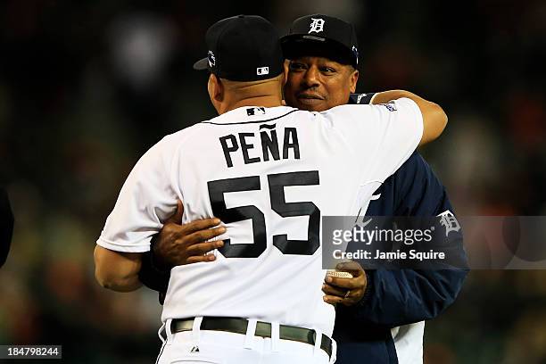 Brayan Pena of the Detroit Tigers embraces former Tiger Lou Whitaker during pre-race ceremonies for Game Four of the American League Championship...