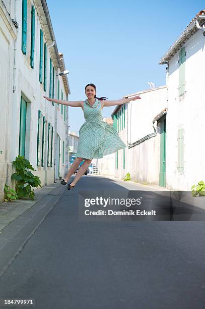 woman flying over the road - charente maritime stock pictures, royalty-free photos & images