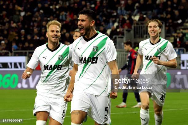 Martin Erlic of Sassuolo celebrates his goal 0-1 with the team mates during the Serie A TIM match between Cagliari Calcio and US Sassuolo at Sardegna...