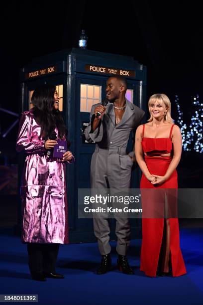 Yinka Bokinni with Ncuti Gatwa and Millie Gibson as Ncuti Gatwa illuminates The London Eye in tribute to his new title role in "Doctor Who" at London...