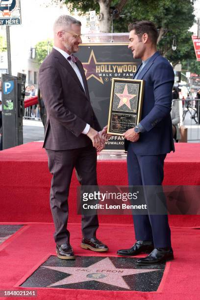 Marc Malkin and Zac Efron attend the Hollywood Walk of Fame Star Ceremony Honoring Zac Efron on December 11, 2023 in Hollywood, California.