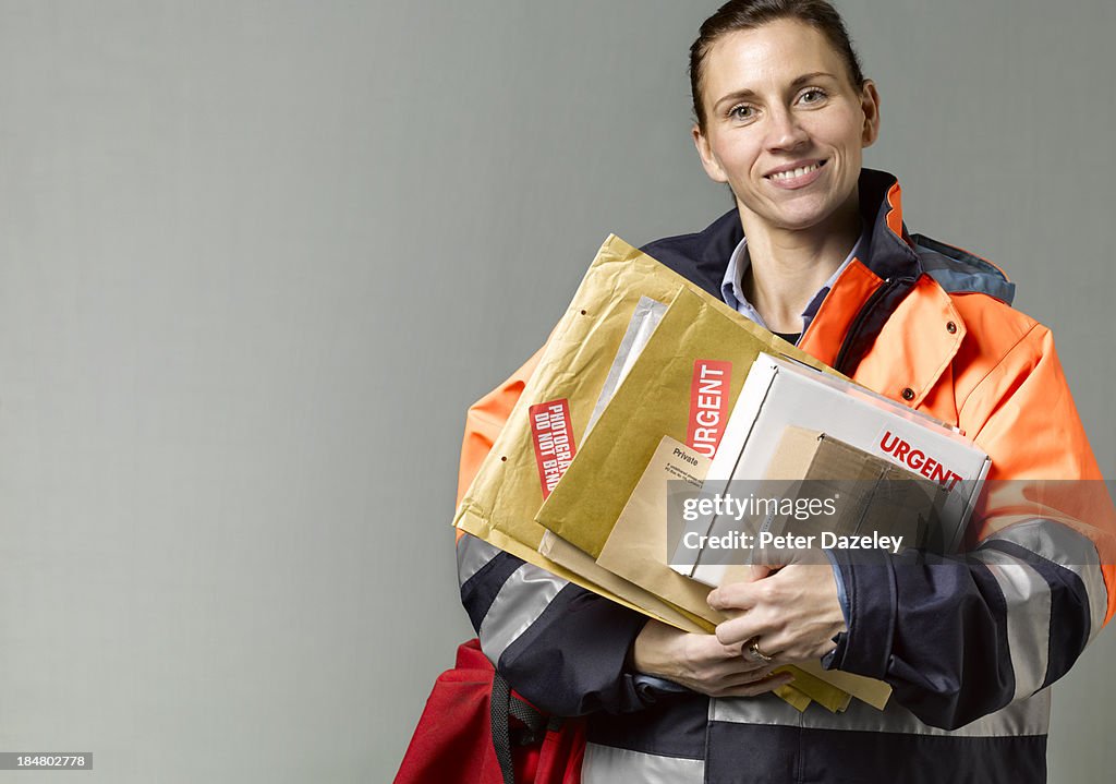 Courier/postwoman with copy space