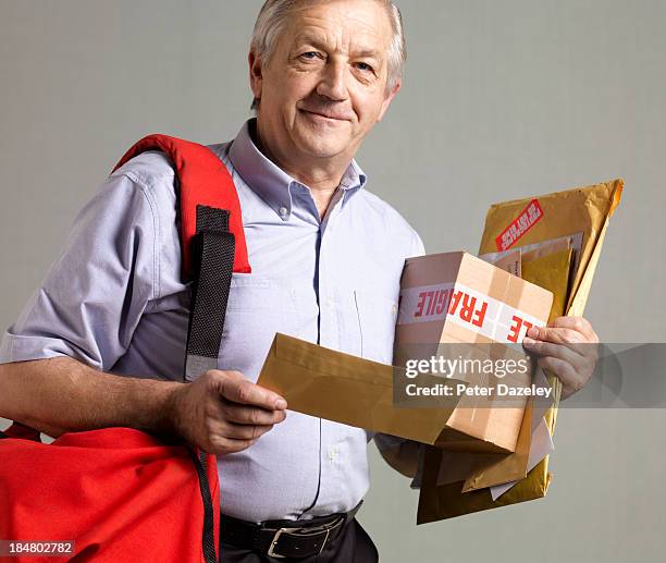 courier/postman in sorting office - delivery person on white stock pictures, royalty-free photos & images