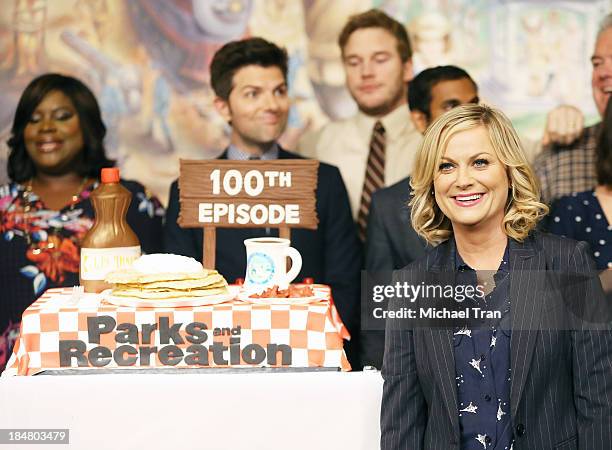 Amy Poehler and the cast of "Parks And Recreation" attend the their 100th episode celebration held at CBS Studios - Radford on October 16, 2013 in...
