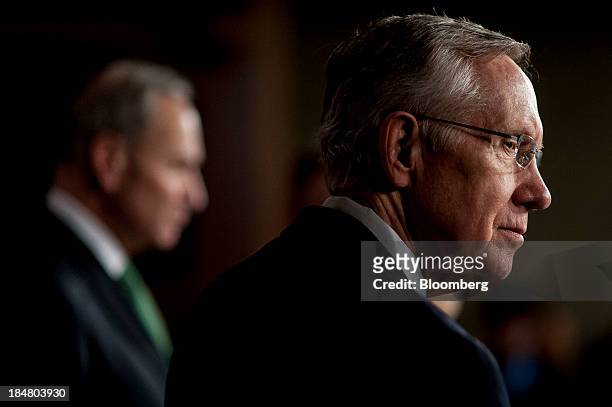 Senate Majority Leader Harry Reid, a Democrat from Nevada, right, and Senator Charles Schumer, a Democrat from New York, attend a news conference at...