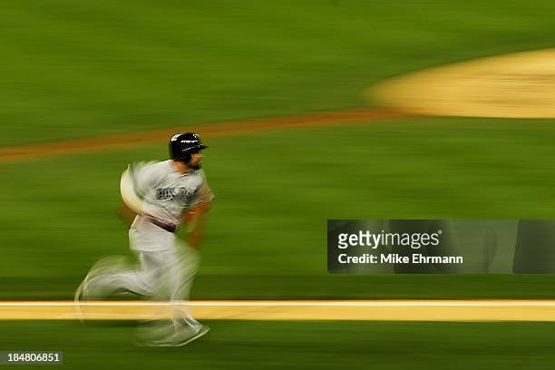 Shane Victorino of the Boston Red Sox runs after hitting a double in the seventh inning against the Detroit Tigers during Game Four of the American...