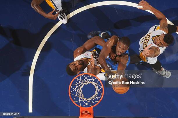 Bernard James of the Dallas Mavericks shoots against Hilton Armstrong of the Indiana Pacers at Bankers Life Fieldhouse on October 16, 2013 in...