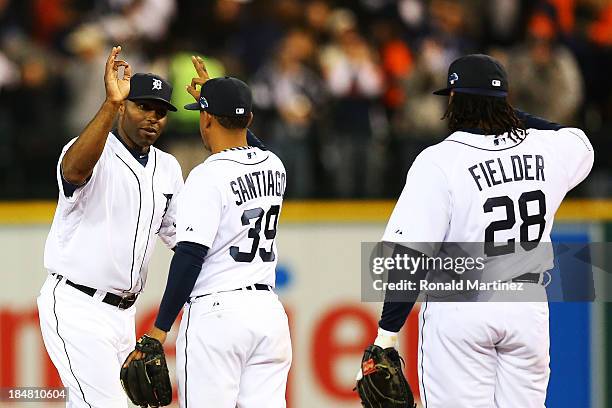 Torii Hunter celebrates with Ramon Santiago and Prince Fielder of the Detroit Tigers after they defeated the Boston Red Sox 7 to 3 in Game Four of...