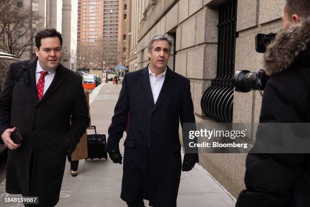 Michael Cohen, former personal lawyer to US President Donald Trump, center, exits federal court in New York, US, on Thursday, Dec. 14, 2023. A...
