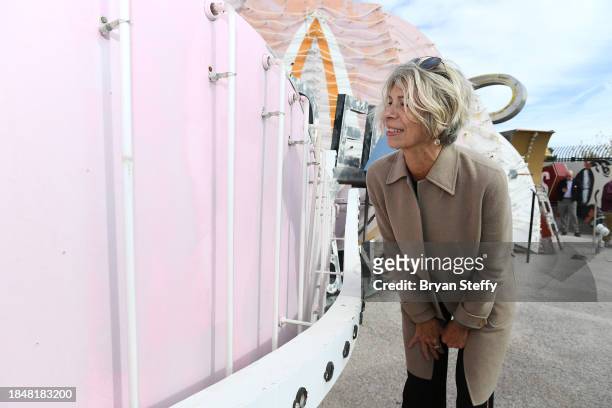 Opuzen owner and president and donor Felicia French inspects a portion of the sign to be restored during the announcement of The Flamingo Las Vegas...