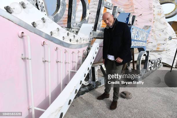 And donor Andrew Pascal inspects a portion of the sign to be restored during the announcement of The Flamingo Las Vegas Hotel and Casino plume sign...