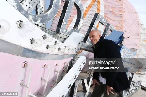 And donor Andrew Pascal inspects a portion of the sign to be restored during the announcement of The Flamingo Las Vegas Hotel and Casino plume sign...