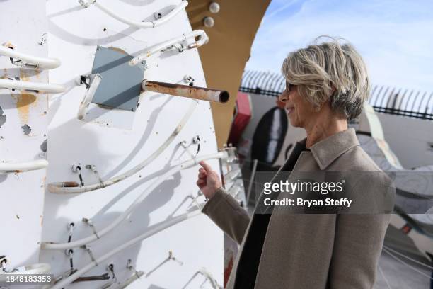 Opuzen owner and president and donor Felicia French inspects a portion of the sign to be restored during the announcement of The Flamingo Las Vegas...