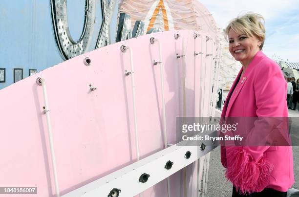 Donor Emily Conner Cooper inspects a portion of the sign to be restored during the announcement of The Flamingo Las Vegas Hotel and Casino plume sign...