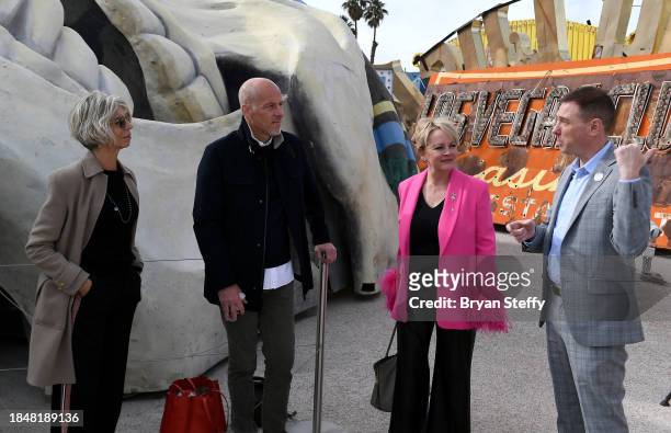 Opuzen owner and president and donor Felicia French, PLAYSTUDIOS CEO and donor Andrew Pascal and donor Emily Conner Cooper listen as The Neon Museum...