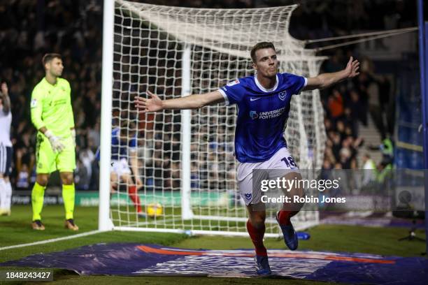 Conor Shaughnessy of Portsmouth FC celebrates after he heads in and scores a goal to make it 1-0 during the Sky Bet League One match between...