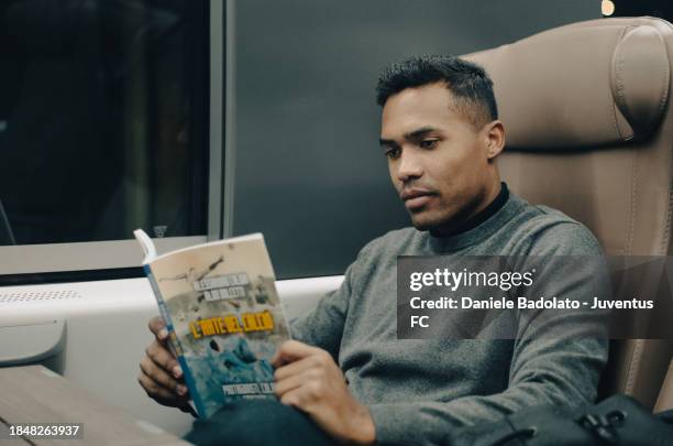 Alex Sandro of Juventus during the team travel to Genoa on December 14, 2023 in Genoa, Italy.