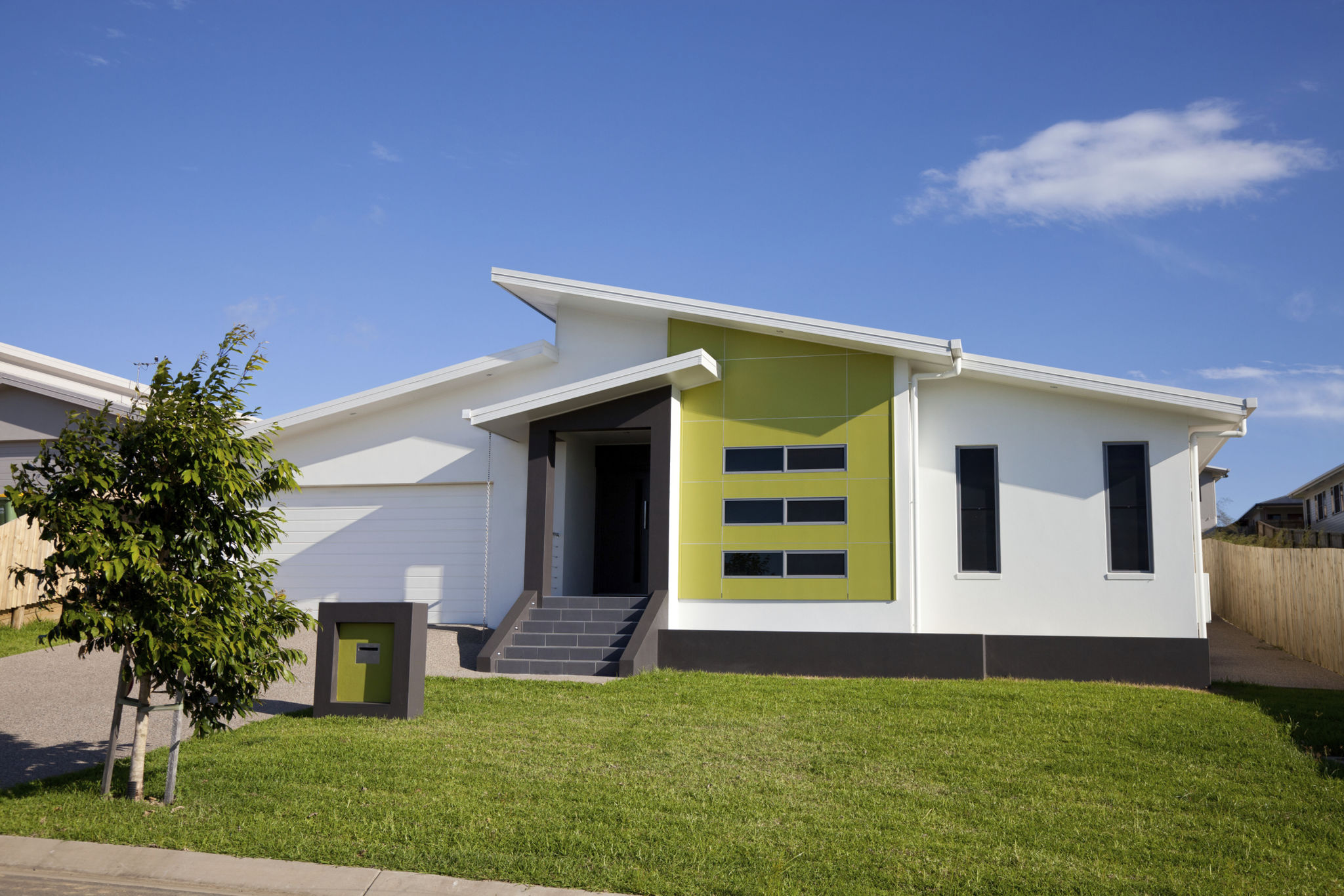 Front view of neat retro-modern family home Front view of neat retro-modern family home