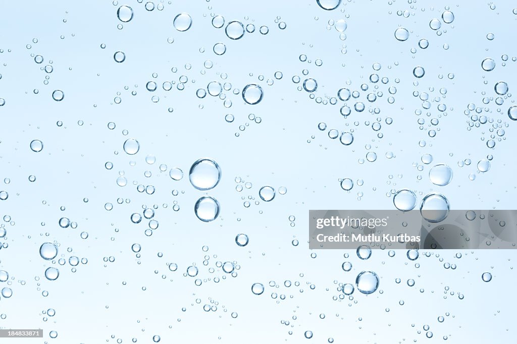 Many small bubbles on sky blue background