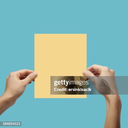 Hand Rested On Paper Hands Holding Paper High-Res Stock Photo - Getty Images
