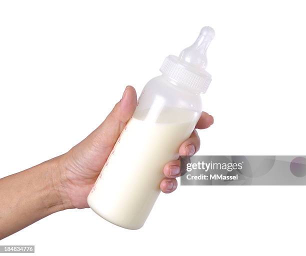 botella de bebé en blanco de leche - aferrarse fotografías e imágenes de stock