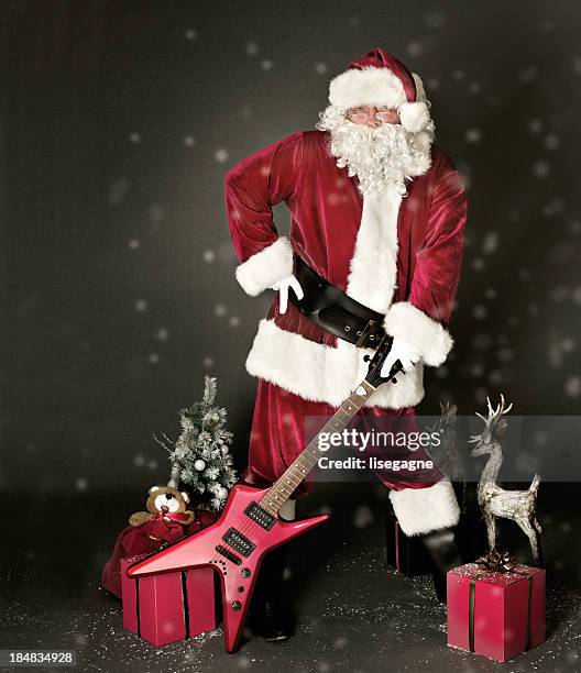 rocking santa - rock music guitar stock pictures, royalty-free photos & images