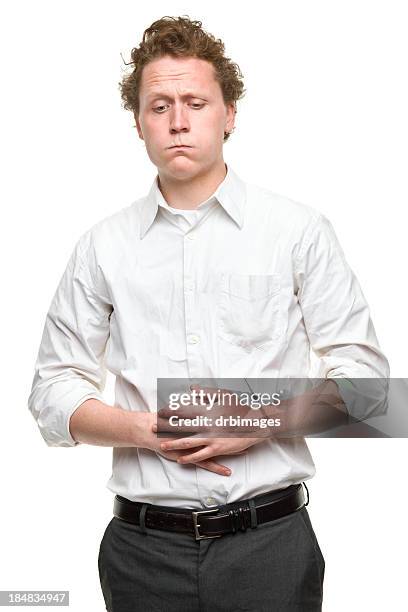 young man with stomach problems - belly rub stockfoto's en -beelden