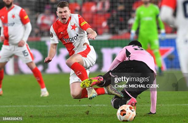 Slavia Prague's Czech midfielder David Doudera and Servette FC's Senegalese midfielder Samba Diba vie for the ball during the UEFA Europa League...