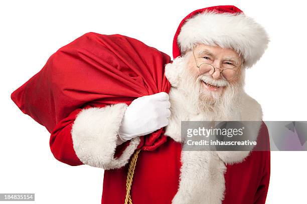 pictures of real santa claus carrying a gift bag - sack stockfoto's en -beelden