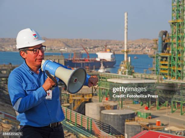 Arturo Rodriguez, Petroperu official, explaining the operation of the New Talara Refinery facilities, operated by Petroperu, with the capacity to...