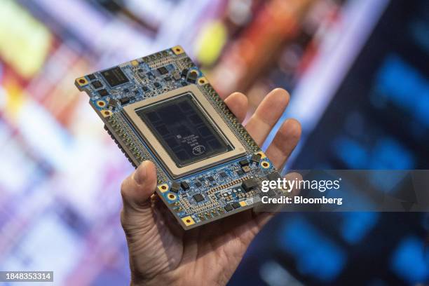Patrick Gelsinger, chief executive officer of Intel Corp., holds an Intel Gaudi3 AI accelerator as he speaks during the Intel AI Everywhere launch...