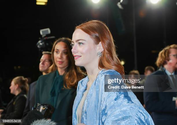 Louise Tutt and Emma Stone attend the UK Gala Screening of "Poor Things" at the Barbican Centre on December 14, 2023 in London, England.