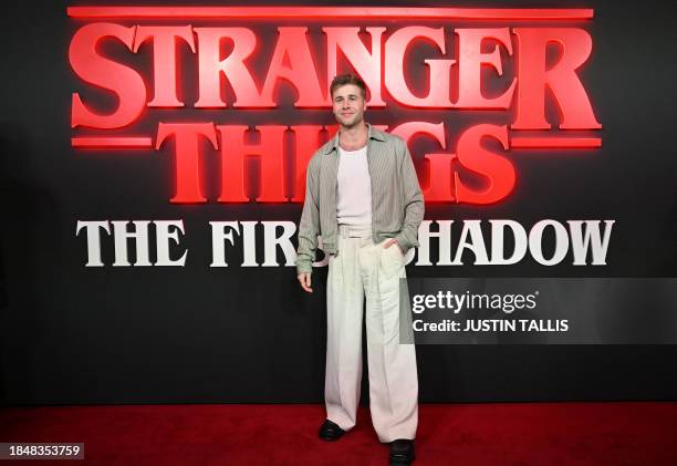 British actor Ed McVey poses on the red carpet upon arrival to attend the West End world premiere of "Stranger Things: The Last Shadow" stage play at...