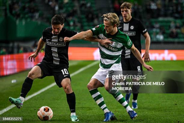 Sporting's Danish midfielder Morten Hjulmand vies with Sturm Graz's Georgian midfielder Otar Kiteishvili during the UEFA Europa League 1st round day...