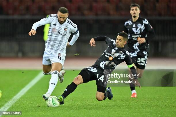 Cenk Tosun of Besiktas in action against Jonathan Sabbatini of Lugano during UEFA Europa Conference League Group D week 6 football match between...