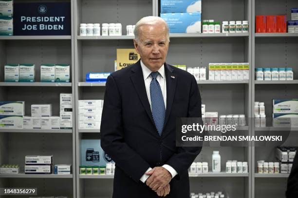 President Joe Biden listens as David Mitchell , President and Founder, Patients for Affordable Drugs, speaks about lowering prescription drug costs...